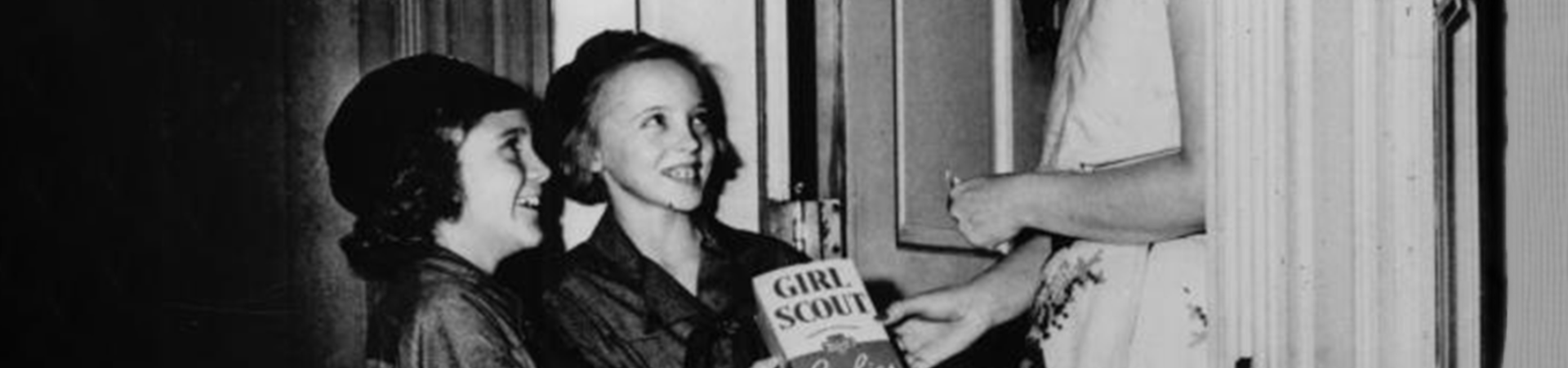  historical photo of girl scouts selling cookies door to door 