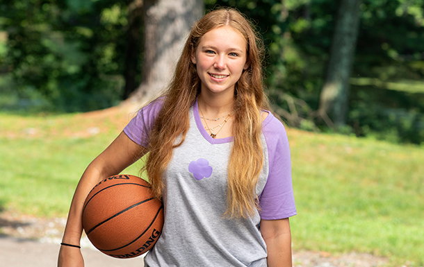 young girl outside smiling