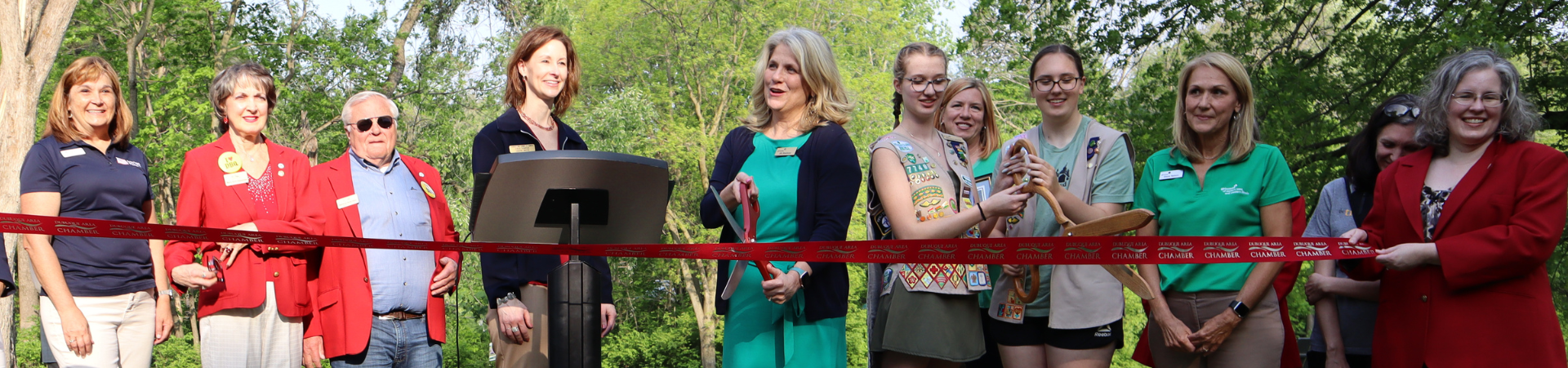  girl scout supporters at a ribbon cutting ceremony 